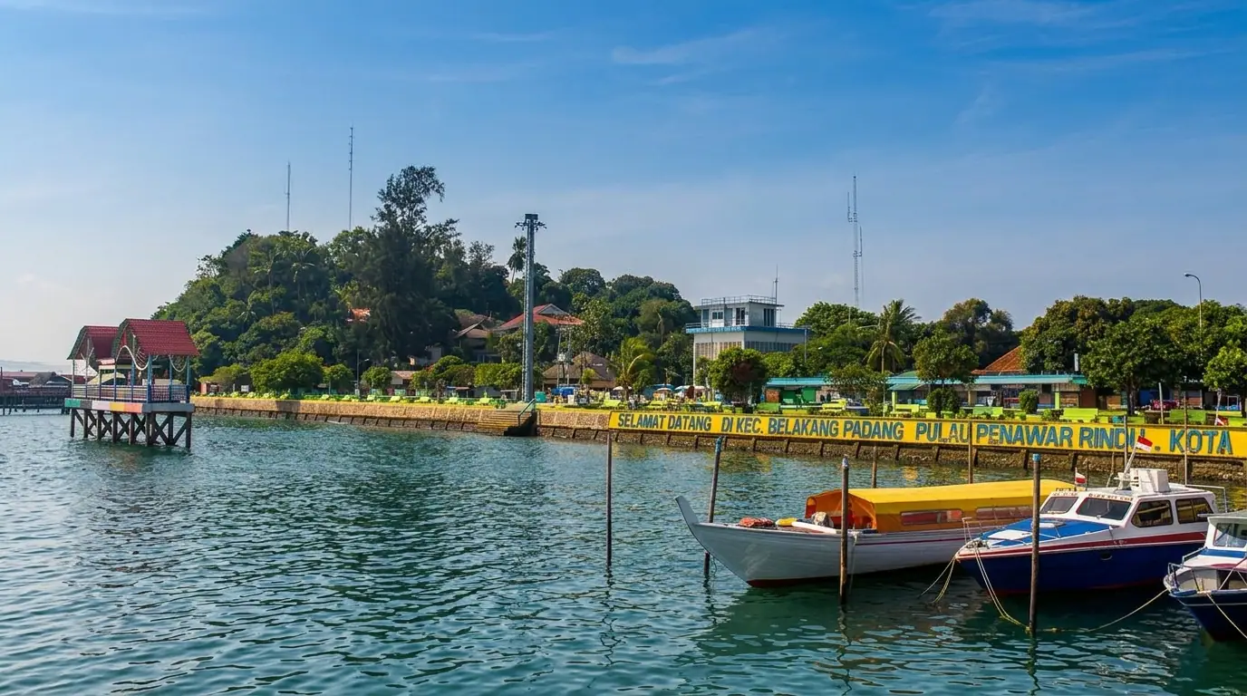Belakang Padang waterfront with boats and the island coastline in Batam.